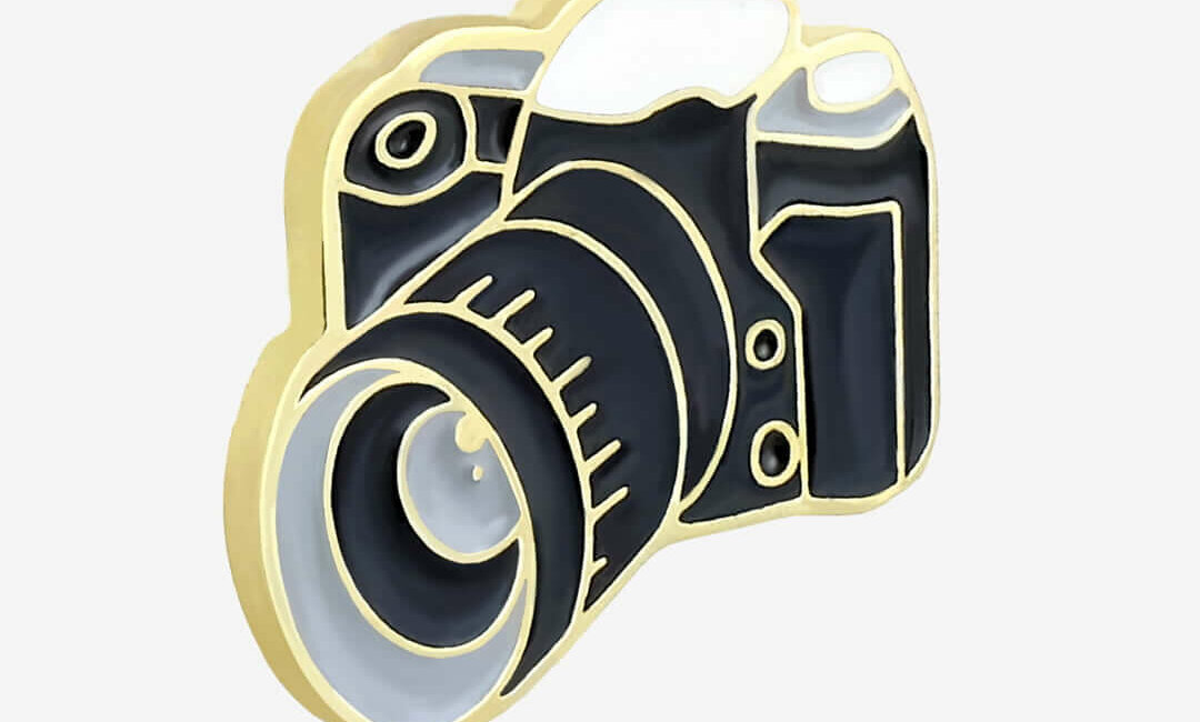 Show your photographic passion with a 'Camera' enamel pin badge